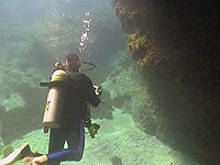 Scuba Diver by Large Coral formations - photo by Pepe Scuba - Maya Expeditions