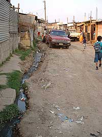 Unidos por la Paz, Street with sewer on side. Guatemala - Maya Expeditions